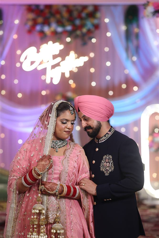 Punjabi couple under Better Together neon sign by Rattu Studio Jalandhar